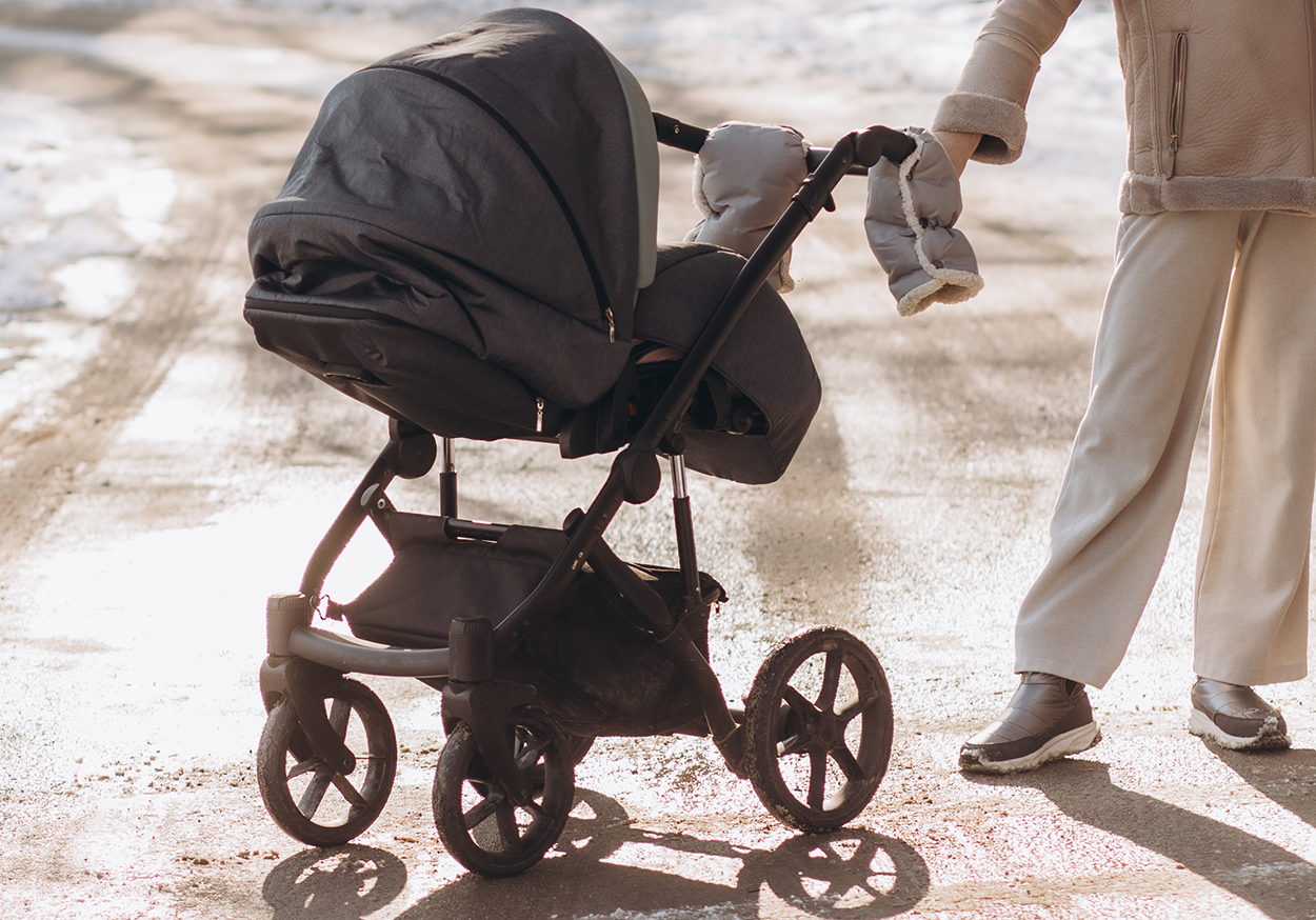a-young-mother-posing-with-a-baby-stroller-in-wint-2025-03-13-14-29-31-utc